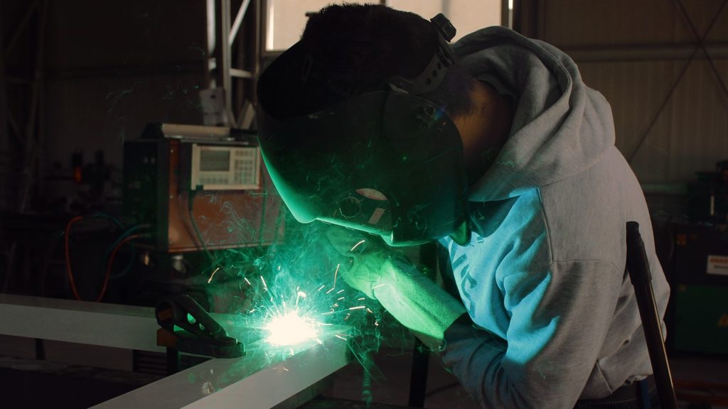 person welding steel